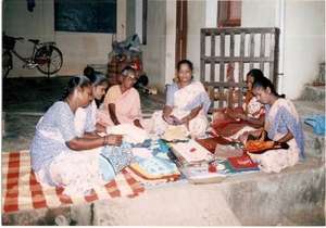 SUEB SHG member sells sarees to her neighbors