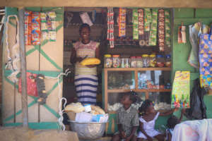 Adwoa holding the bread she sells.
