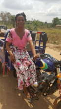 Akua with her her "aboboyaa" or tricycle