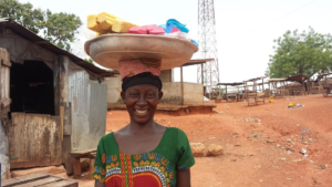 Akosua selling her handmade soaps to the community