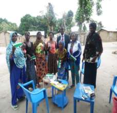 Group at Timeabu displaying their cheque books