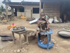 Ruth prepares kenkey for sale in her shop.