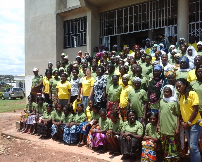 a large grouo of women poses for a picture at the Women's Leadership Summit