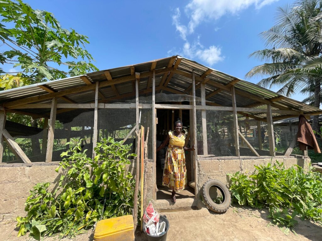 Vivian infront of her pigsty