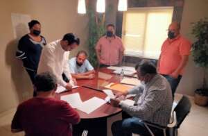 Signing of documents for legally acquired lands.