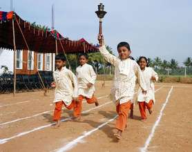 Children competing in track events