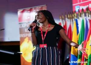 YoSA student Olive from Kenya on stage at LIYSF