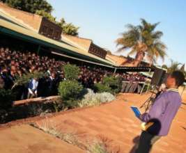 Edzani presents to his school in South Africa