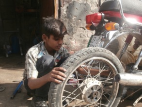 Ali at the car repair workshop
