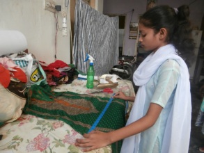 Muskaan learning how to stitch