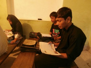 Ali reads in class