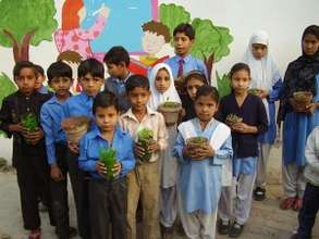 students show off their plants with pride