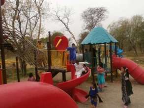 students enjoy the play area at the park