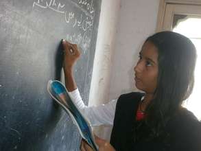 Natalia demonstrating an answer on the board
