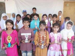 Top position holders & graduates with their awards