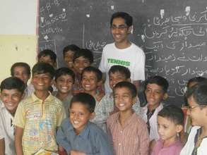 A volunteer visits a Paid to Learn school