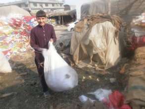 Sardar picking garbage in the fruit market
