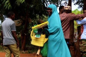 Woman receiving new farming tools