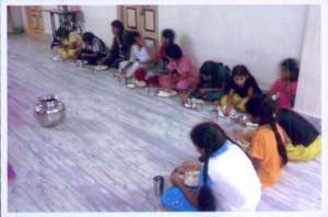 Girls feeding the food