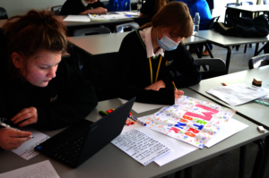 Students working on team work experience challenge