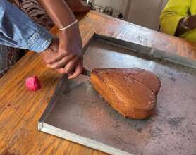 Lady in transition cutting cake
