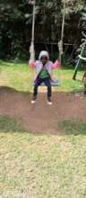 One of the kids swinging