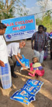 Elderly Victim happily receiving relief materials
