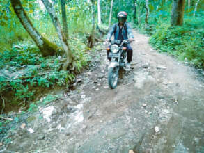 Our teacher goes to the school via the dirt road