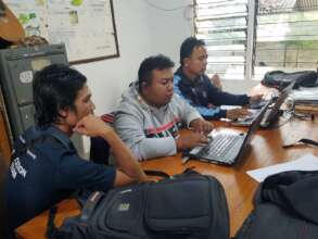 The teachers preparing a report