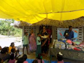 A Child receiving casual dresses, Lunch Box, etc.