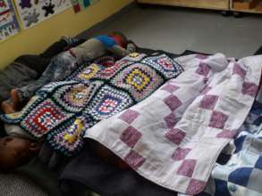 Children sleeping under blankets of joy
