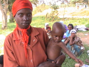 Caroline and Doreen after receiving 20 kgs of rice