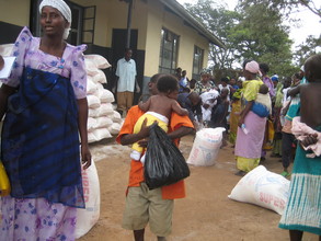 An HIV positive mother with her children after getting food