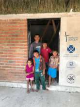 Ikoot family with their new house