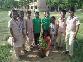 planting trees in Siruganur school