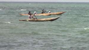 Two young girls on board a local canoe