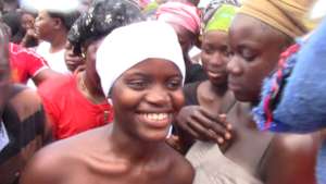 Hawa smiling during the ceremony