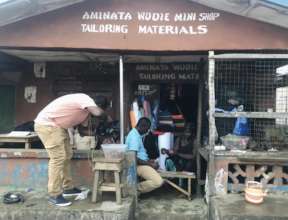 Wudie and his wife Aminata at their new mini shop