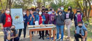 Young people baked chipa, a typical local food