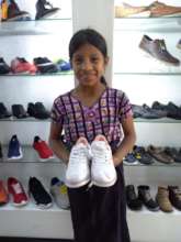 Sandra getting her first pair of new school shoes