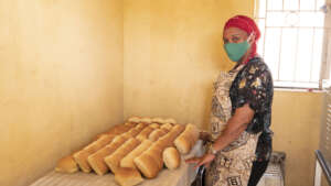 Woman baking bread at Bondeko in Kampala, UGANDA