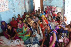 Empower Foundation team interacting with women .