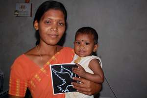 One of our House Mothers holding Lucy