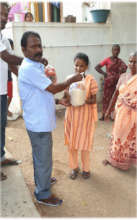 Blind girl eagerly receiving food groceries