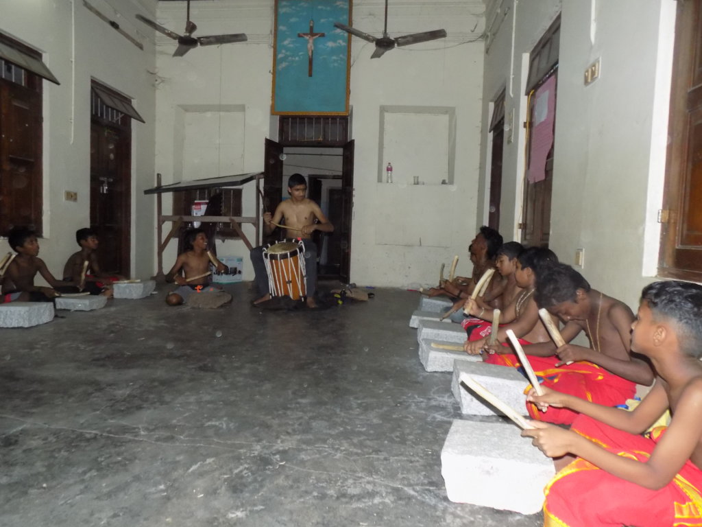 Musical instruments for 17 slum children in India