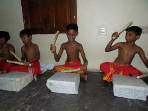 Musical instruments for 17 slum children in India