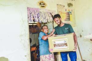 An elderly lady shedding a tear of joy,