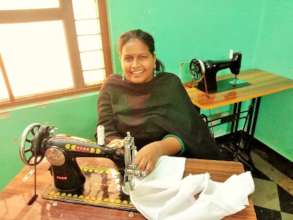 Banu at her sewing machine