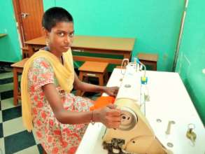 Nithya at her sewing machine