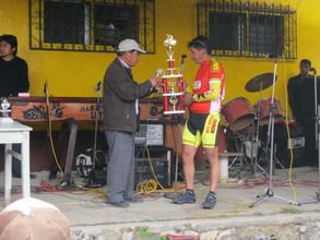 Winner of the cycling race receiving his trophy